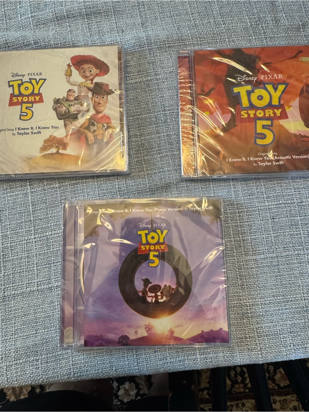 Taylor Swift Toy Story 5 Kids CD Trio — Purple, Orange, Cream Covers